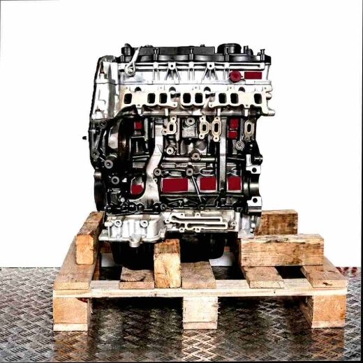 Side view of a black and silver CYR5 engine on a wooden pallet against a white background. The engine is vertically oriented.