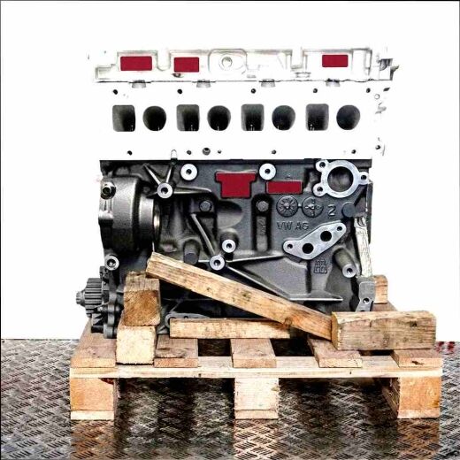 Side view of a DAWA engine on a wooden pallet against a white background. The engine block is clearly visible.
