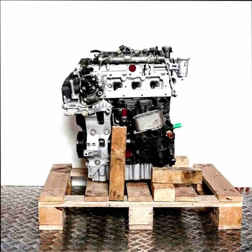Side view of a DFGA engine on a wooden pallet against a white background. The black and silver engine is vertically oriented.