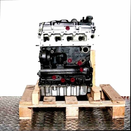 DFGC engine on wooden pallet against a white background. Gray and black engine with yellow caps, vertically oriented.