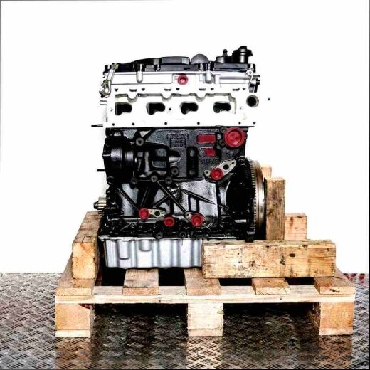 Side view of the DGDA engine on a wooden pallet against a white background. The engine features black, silver, and yellow accents.