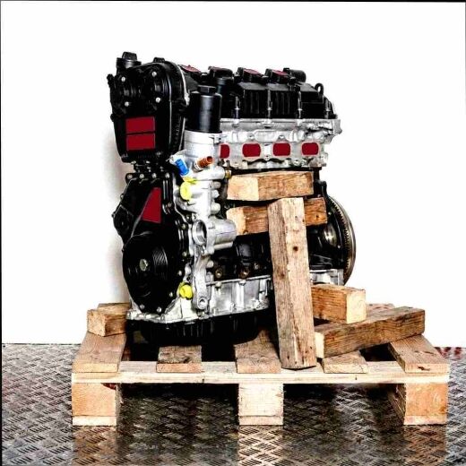 DJHA engine on a wooden pallet against a white background. The silver and black engine is viewed from the side.