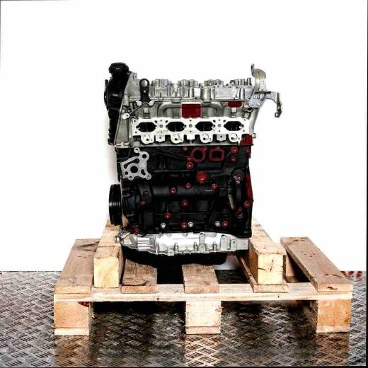 DNFC engine on a wooden pallet against a white background. Side view of the black and grey engine, showing metallic components.