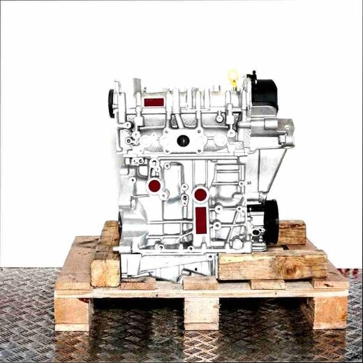 DPCA engine on wooden pallet against white background. Silver engine block with black components and yellow dipstick, side view.