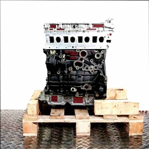 DTRC engine on a wooden pallet against a white background. Side view of the black and silver engine.