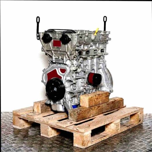 F 12 SHL engine on a wooden pallet against a white background. Side view image showcasing engine components like belts and pulleys.