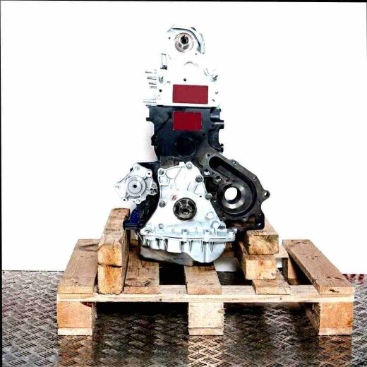 Side view of an F9Q 730 engine on a wooden pallet against a white background. The engine features silver and black components.
