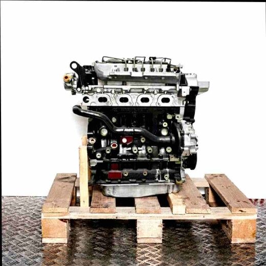 F9Q 870 engine on a wooden pallet against a white background. This front view of the engine clearly displays its components. The dark engine block and lighter upper parts are easily visible.