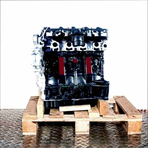 Black G9T 743 engine on a wooden pallet against a white background. Side view of the engine with silver accents.