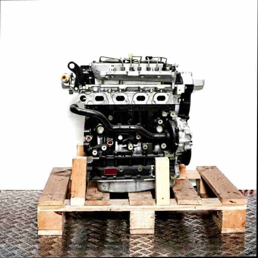 Side view of a G9T 750 engine on a wooden pallet against a white background. The engine is predominantly black and gray with metallic and black components.