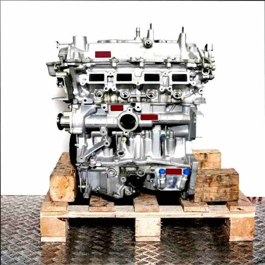 Silver engine H5F 404 on a wooden pallet against a white background. Side view of the engine, perfect for technical illustrations.
