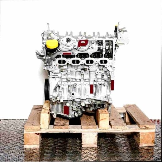 Silver engine H5H 470 on a wooden pallet against a white background. The engine with a yellow cap is viewed from the side.