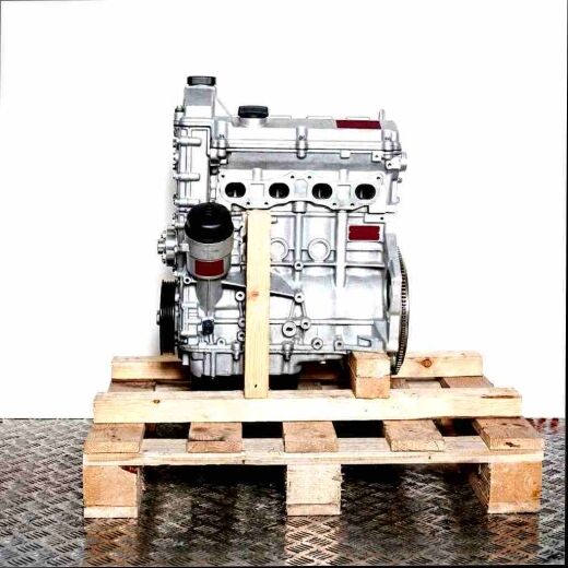 Silver engine M43 B19 (194E1) on a wooden pallet against a white background. Side view, vertical orientation.