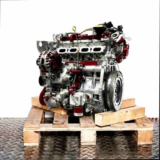 M5M 450 engine on a wooden pallet against a white background. The engine displays intake manifold, alternator, and pulleys. Vertical orientation.