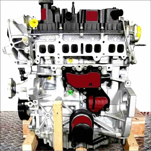 M8DB engine on a wooden pallet against a white background. The silver, black, and yellow engine is fully visible.