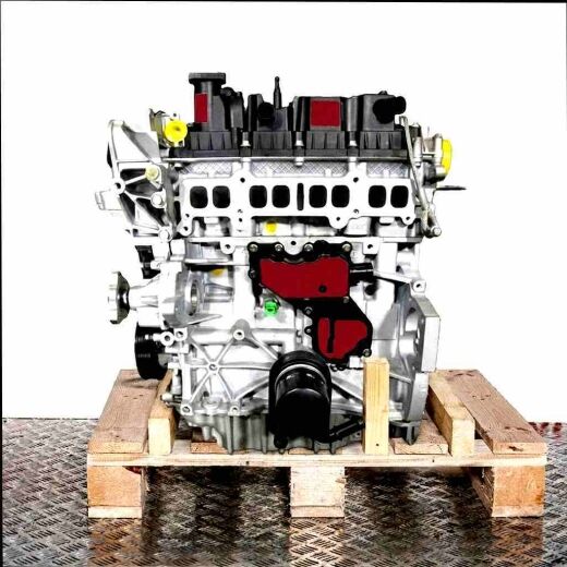 Side view of an M9MC combustion engine on a wooden pallet against a white background. The engine features yellow fasteners and black covers.