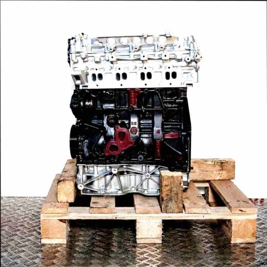 Side view of engine M9R 788 on a wooden pallet against a white background. The engine block features silver and black colors.