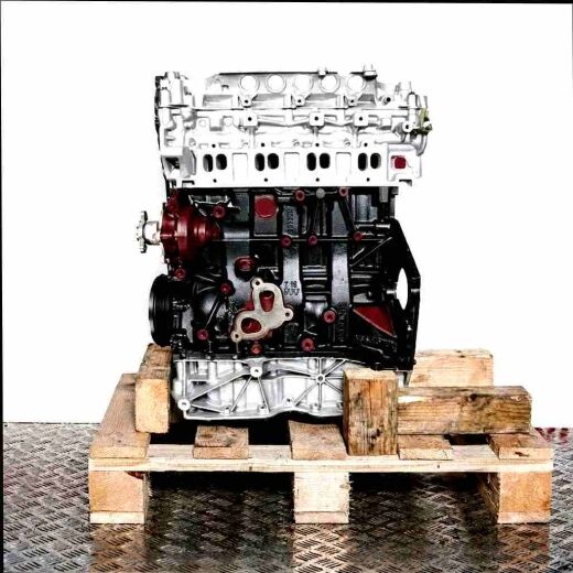 M9T 676 engine on a wooden pallet against a white background. Side view of the complete engine featuring light grey and black metal components.
