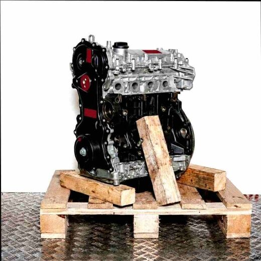 M9T 698 engine on a wooden pallet against a white background. Angled side view, perfect for automotive applications.