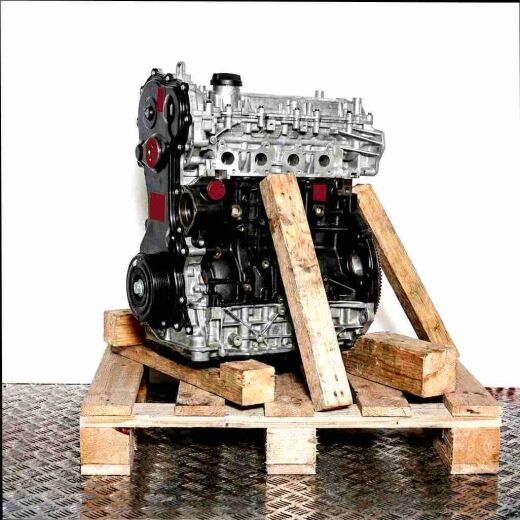 Complete M9T 700 engine on a wooden pallet against a white background. The engine is viewed at a slight angle.