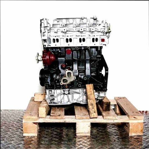 M9T 880 engine on a wooden pallet against a white background. The silver and black engine is viewed from the side.