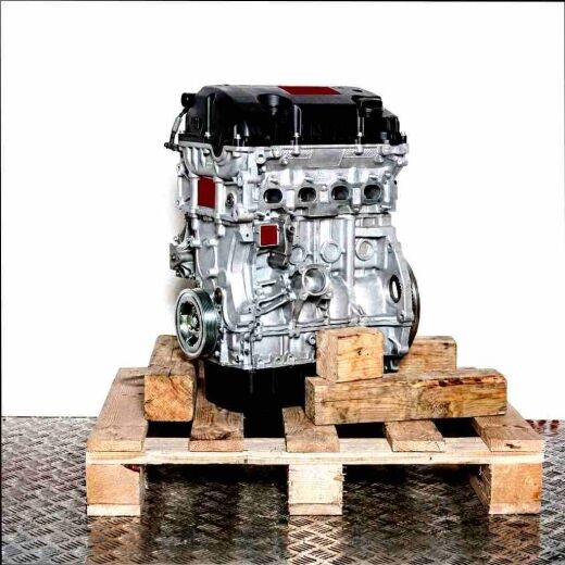 N16 B16 A engine on a wooden pallet against a white background. The silver engine with black accents and pulley is shown from the side.