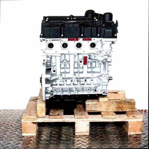 N20 B20 B engine on a wooden pallet against a white background. The silver engine block and black cover are visible.