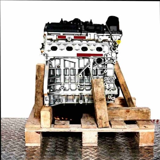 Side view of an N46 B20 B engine on a wooden pallet against a white background. The engine is vertically oriented.