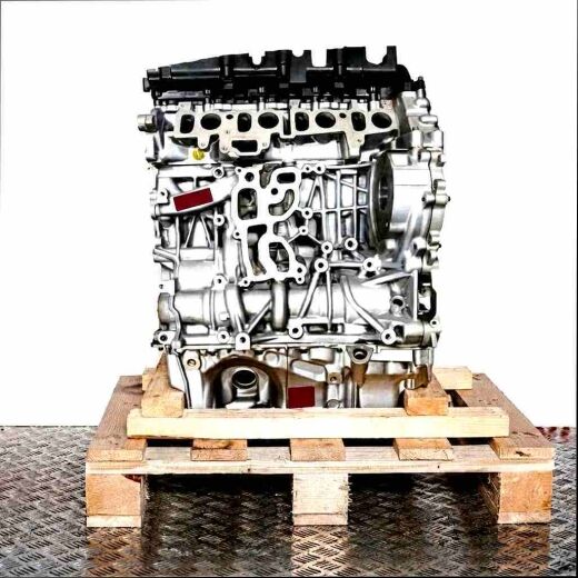N47 D20 D engine on a wooden pallet against a white background. The engine block and attached components are visible.