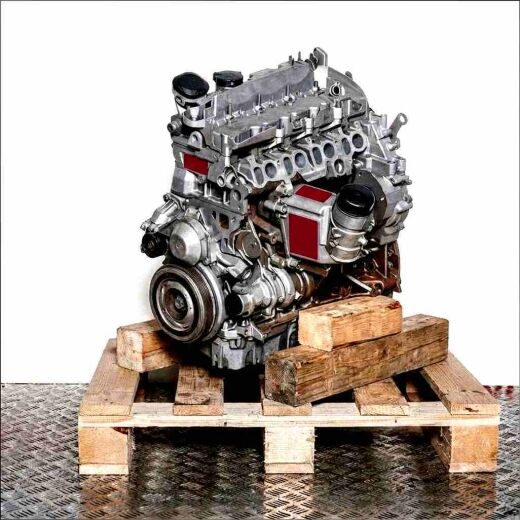 N55 B30 A engine on a wooden pallet against a white background. Angled view of the engine.