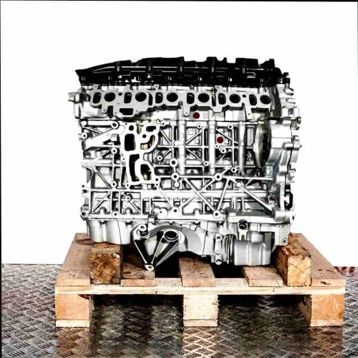 N57 D30 A engine on a wooden pallet against a white background. This high-quality engine is perfect for repairs or replacements.