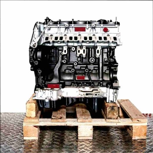 P5-AT engine on a wooden pallet against a white background. Side view of the black and silver engine, vertically oriented.