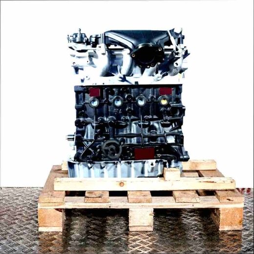 QXWA engine in black and silver on a wooden pallet against a white background. Side view of the engine, vertically oriented.