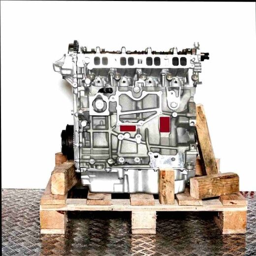 Silver R9CB engine on a wooden pallet against a white background. The engine is fully visible, showcasing its details.