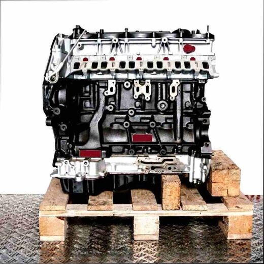 SA2R engine on a wooden pallet against a white background. Black engine block, silver components. Side view of the motor.