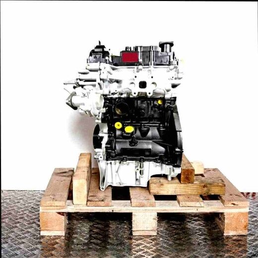 SFCA engine on a wooden pallet against a white background. The black and silver engine with yellow accents is shown from the side.