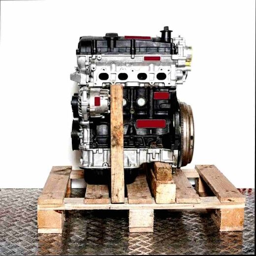 SFCF engine on a wooden pallet against a white backdrop. Side view of the engine showcasing black and silver components, topped with a yellow cap.