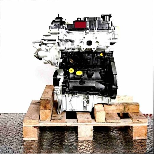 SFJA engine on wooden pallet against a white background. Side view of the internal combustion engine.
