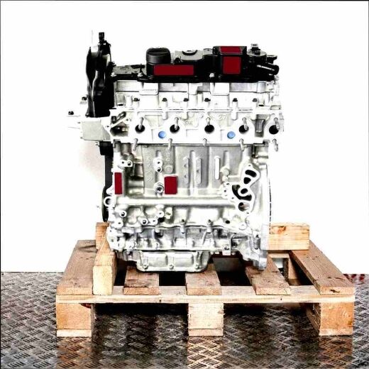 T3CA engine on a wooden pallet against a white background. The silver metal and black plastic components of the engine are visible.