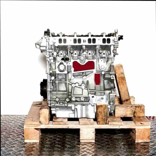 Side view of a TPBA engine on a wooden pallet against a white background. The engine is vertically oriented.