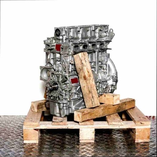 XVCA engine block on a wooden pallet against a white background. Front view of the engine, without additional components.