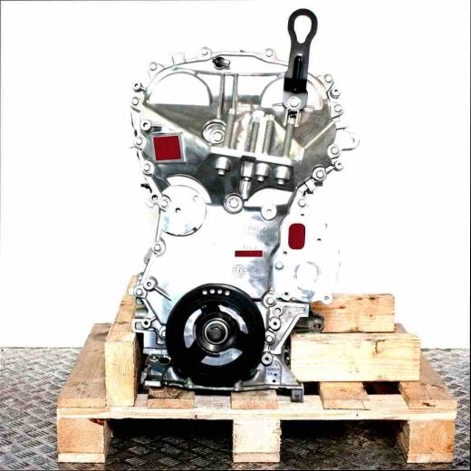 Y1DA engine on a wooden pallet against a white background. Side view of the engine, featuring black components and an oil pan.
