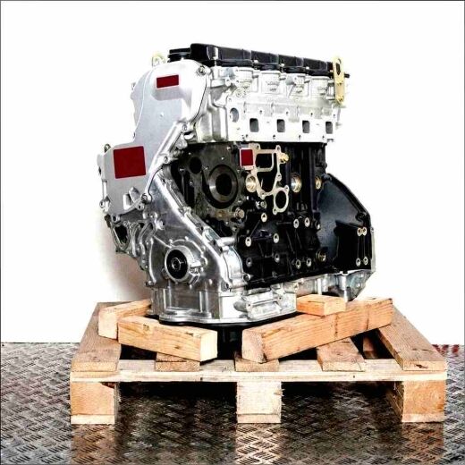 YD22DDTi engine on a wooden pallet against a white background. Angled side view of the engine.