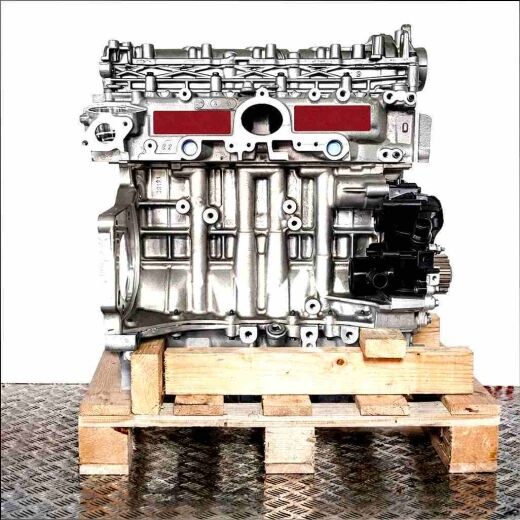 Silver engine YHX (DV5RC) on a wooden pallet against a white background. The engine, with black components, is shown from the side.