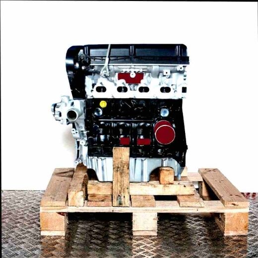 Side view of the Z 16 XE1 engine on a wooden pallet against a white background. Engine block and other parts are visible.
