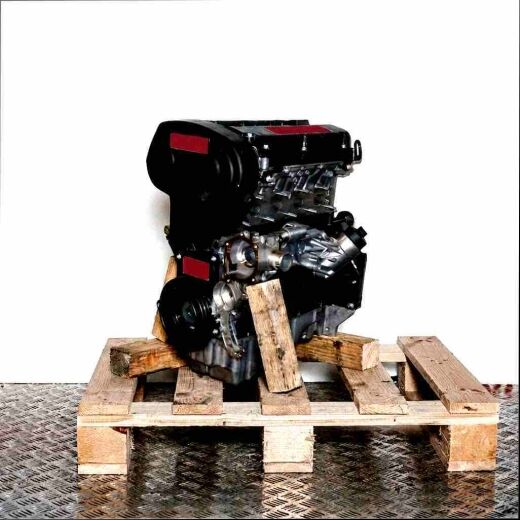 Side view of a black Z 16 XER engine on a wooden pallet against a white background. The engine is slightly angled to the right.